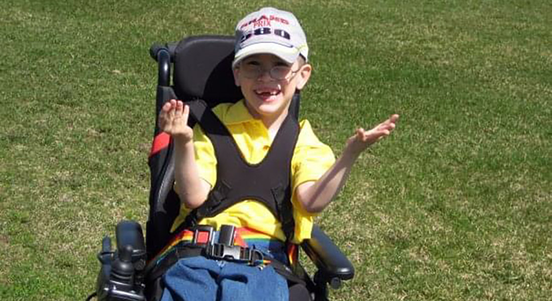 Logan out doors on a sunny day.