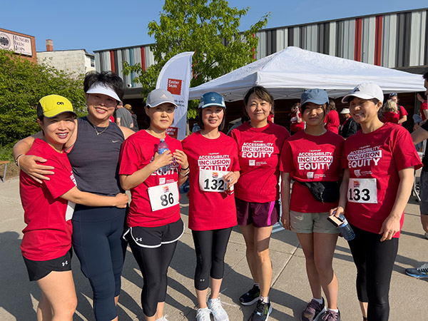 A team poses in red shirts.